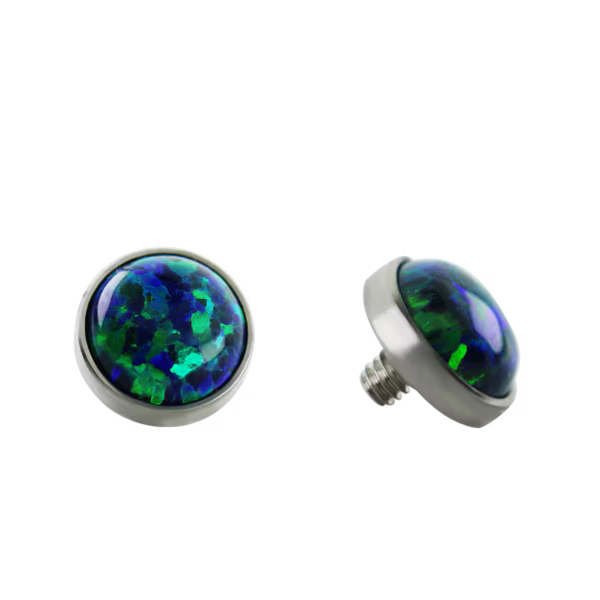 Pair of round stud earrings with multicolored gemstones on a white background