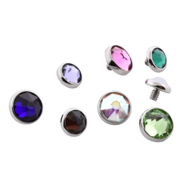 Set of colorful gemstone-like objects on a white background