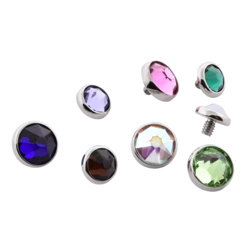 Set of colorful gemstone-like objects on a white background