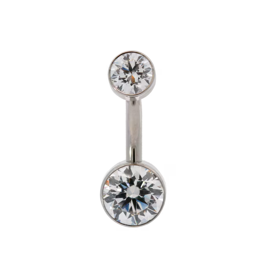 Belly button ring with two large clear gemstones on a white background