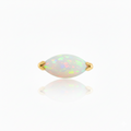 Opal ring with gold band on a white background
