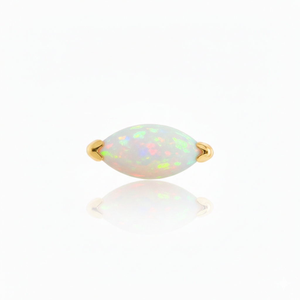 Opal ring with gold band on a white background