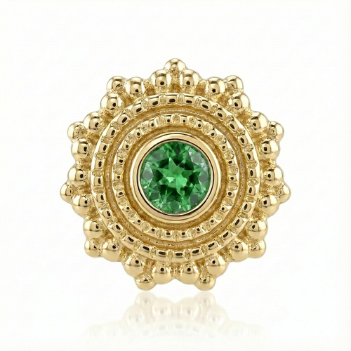 Gold earring with a green gemstone on a white background