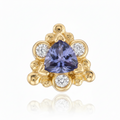 Gold earring with a purple gemstone and smaller diamonds on a white background