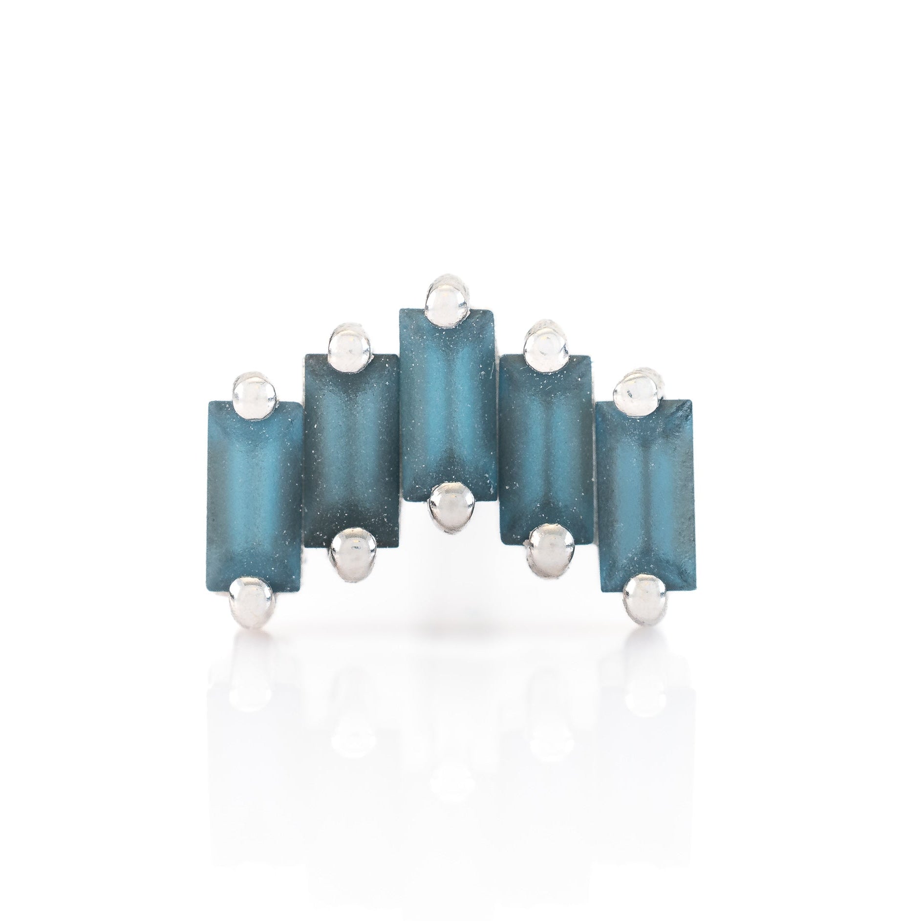 Jewelry piece with blue rectangular stones and silver accents on a white background