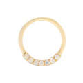 Gold ring with small stones on a white background