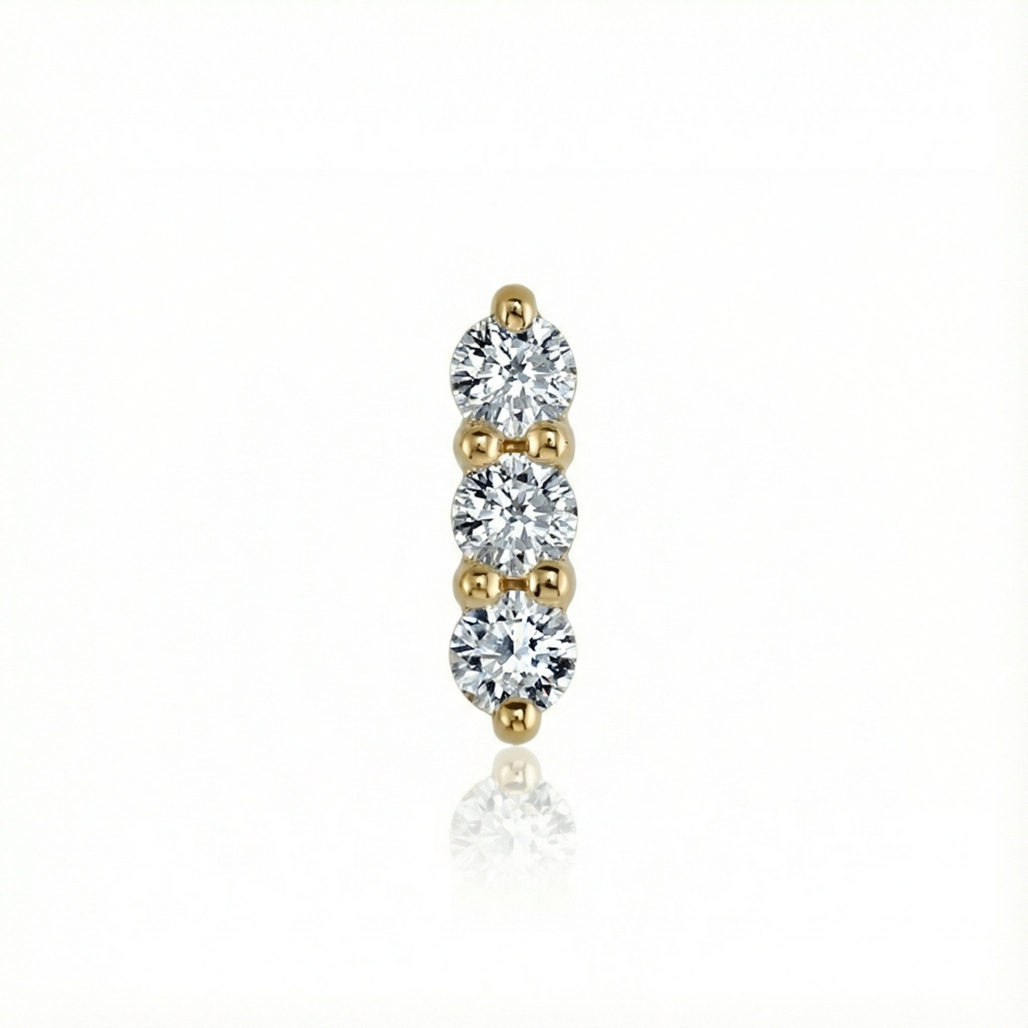 Gold and diamond earring on a white background