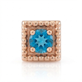 Rose gold end with a blue gemstone on a white background