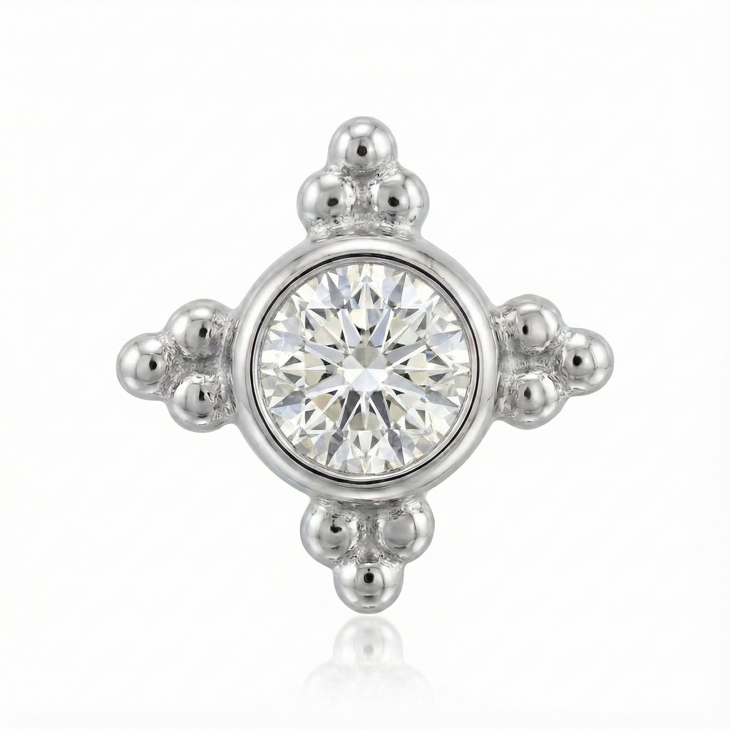 Silver earring with a central gemstone on a white background