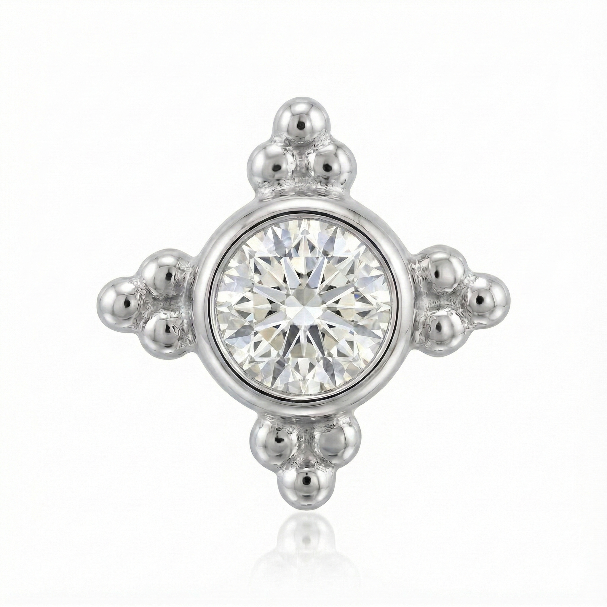 Silver earring with a central gemstone on a white background