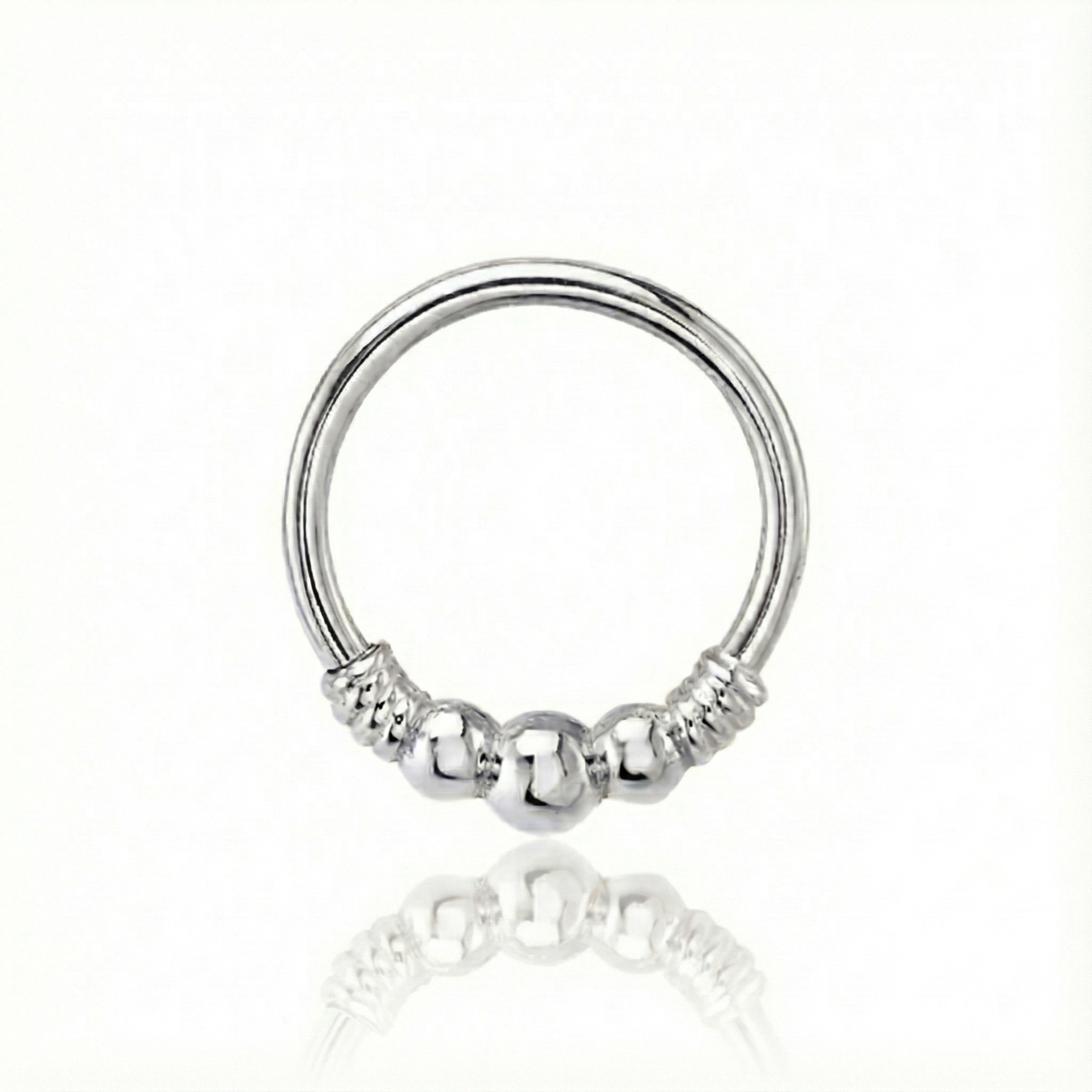Silver ring with beaded design on a white background