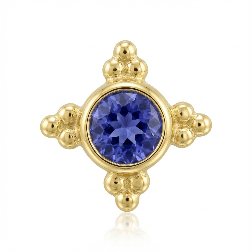 Gold end with a blue gemstone on a white background