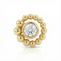 Gold earring with a central diamond on a white background